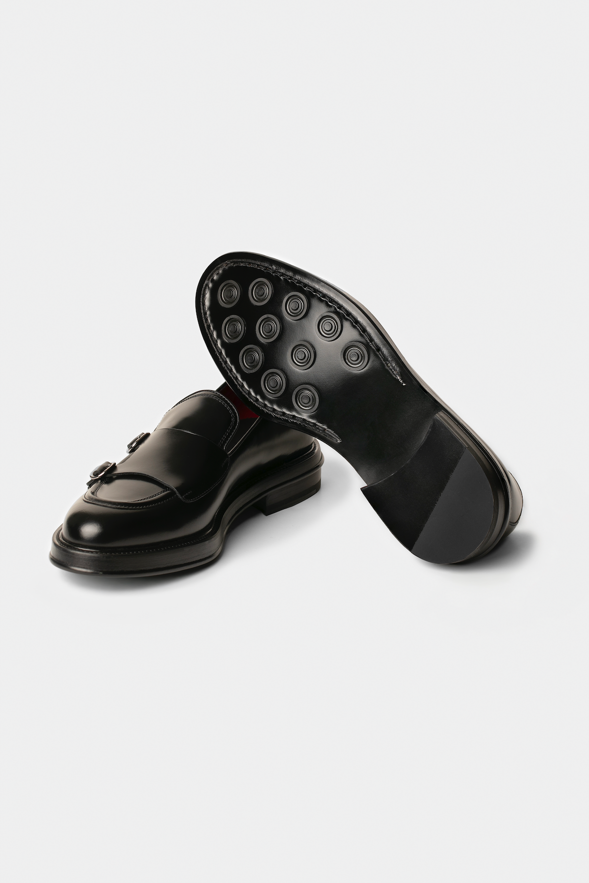 Pantofi Double Monk negri din piele de vițel Florentinodelure cu tălpi de cauciuc aderente.