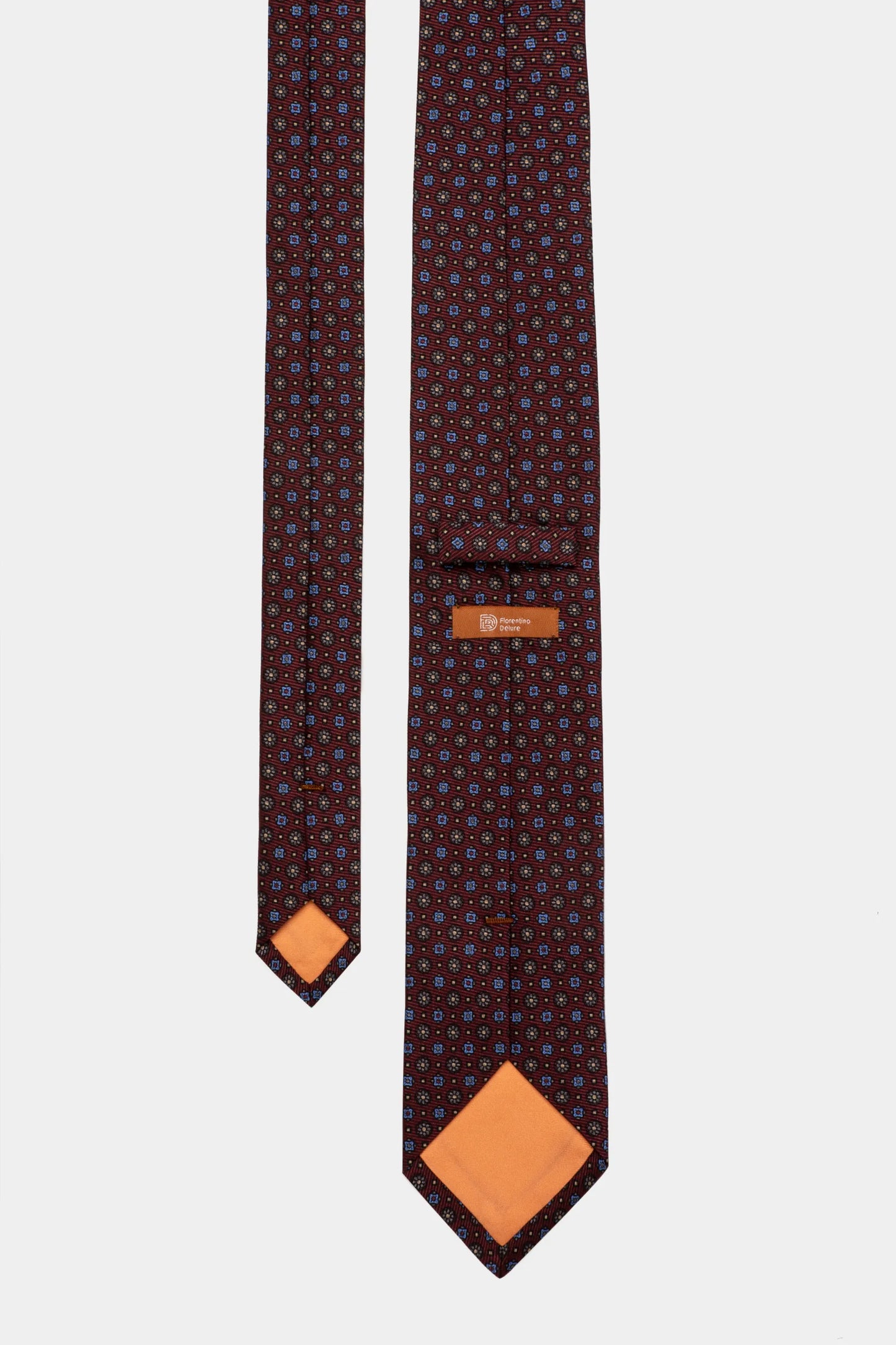 Cravată Bordeaux Print Florentinodelure cu model floral albastru și căptușeală portocalie.